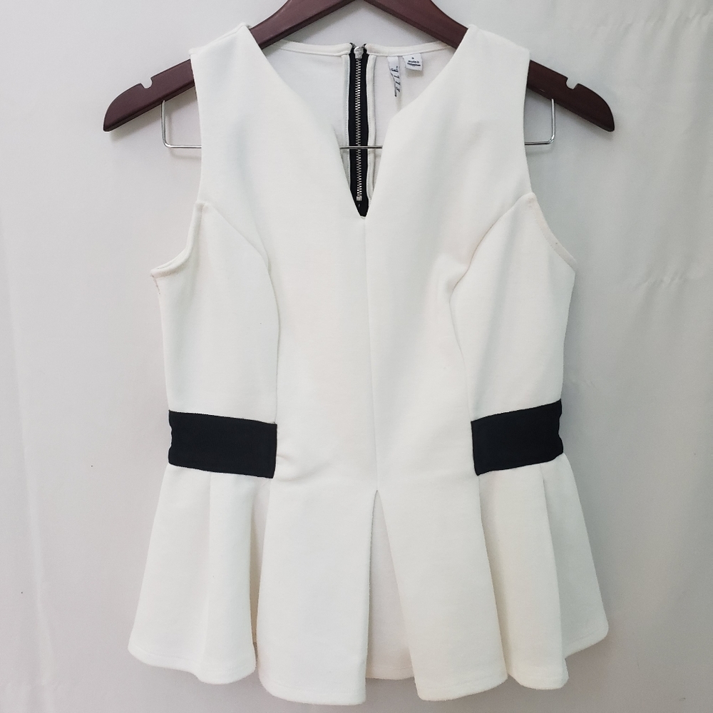 Elle - sleeveless blouse peplum waist line